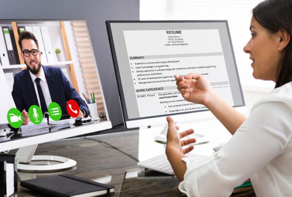 Resume on screen with a zoom session and two people discussing